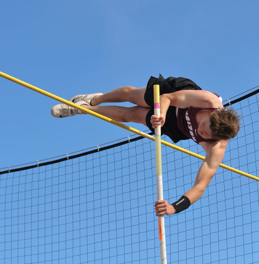 Horizon senior pole vaulter Garett Searls makes an attempt to clear 14 feet, during his school's Rust Buster Track and Field Invitational May 5 at District 12 North Stadium in Westminster. Though he missed at this height, Searls won the event with a school record vault of 13-7 1/4.